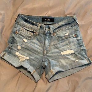 Low rise ripped midi jean shorts